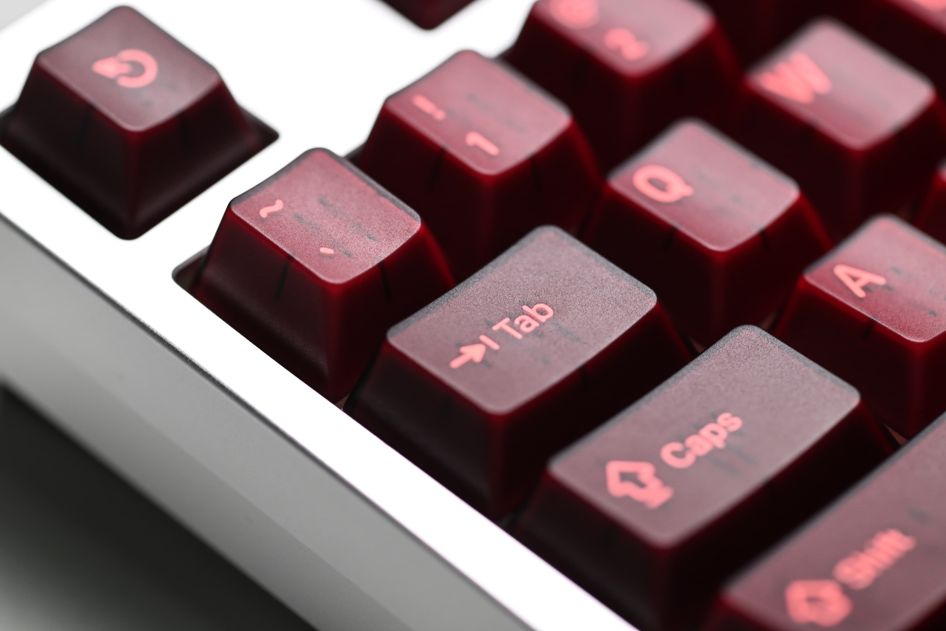 KAP Generation — a set of bright pink and translucent maroon keycaps image 5