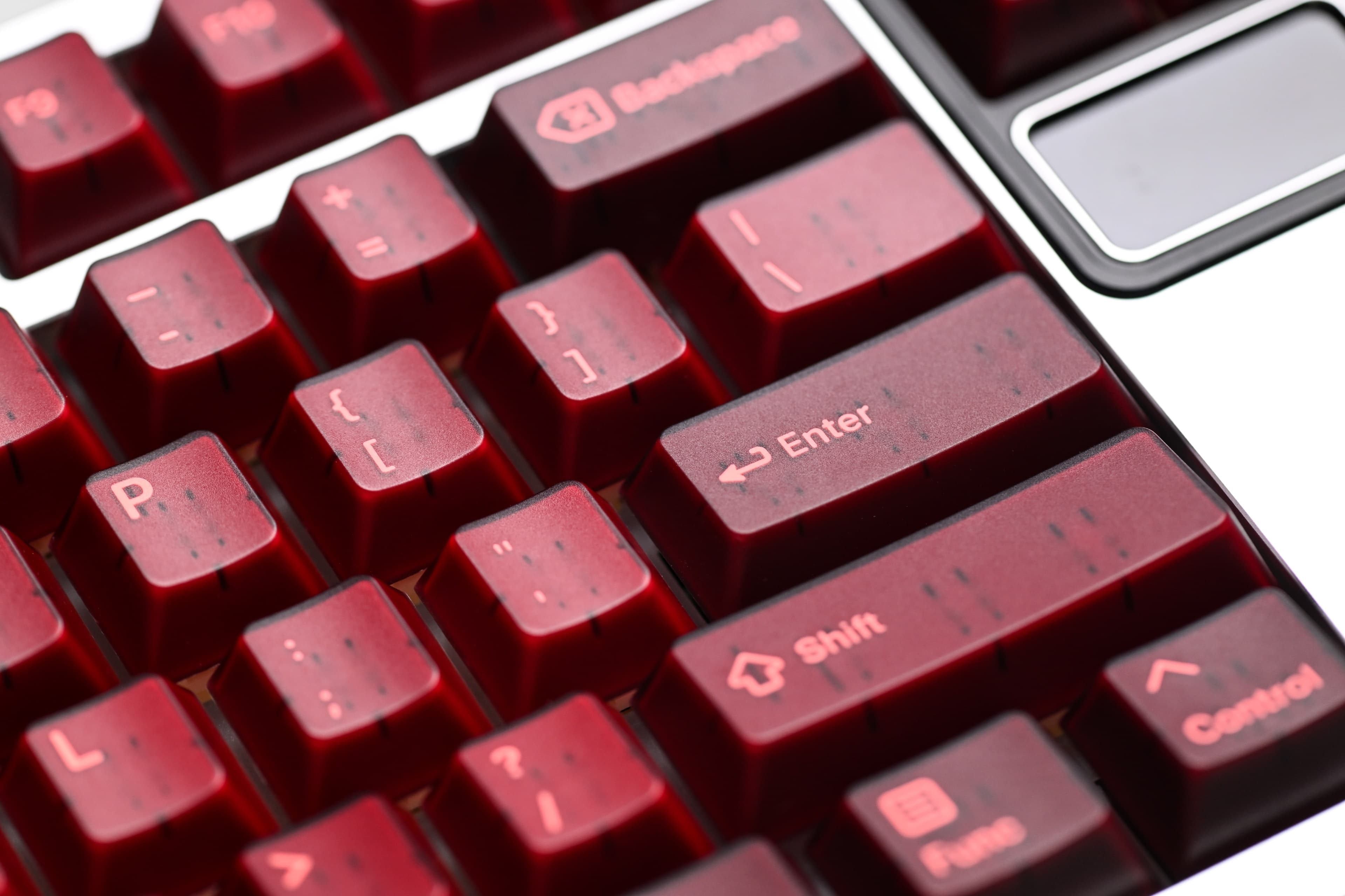 KAP Generation — a set of bright pink and translucent maroon keycaps image 3