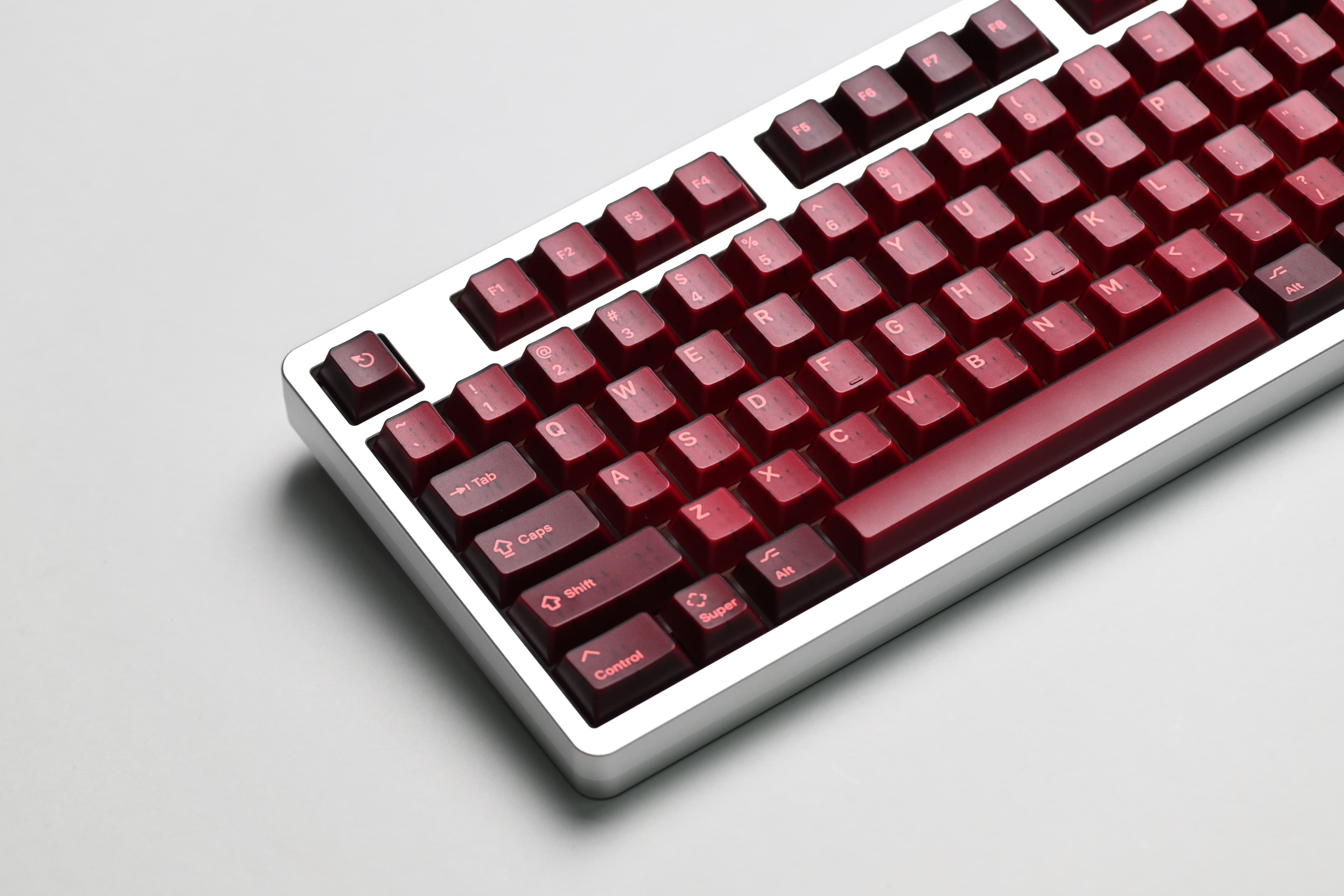 KAP Generation — a set of bright pink and translucent maroon keycaps image 2